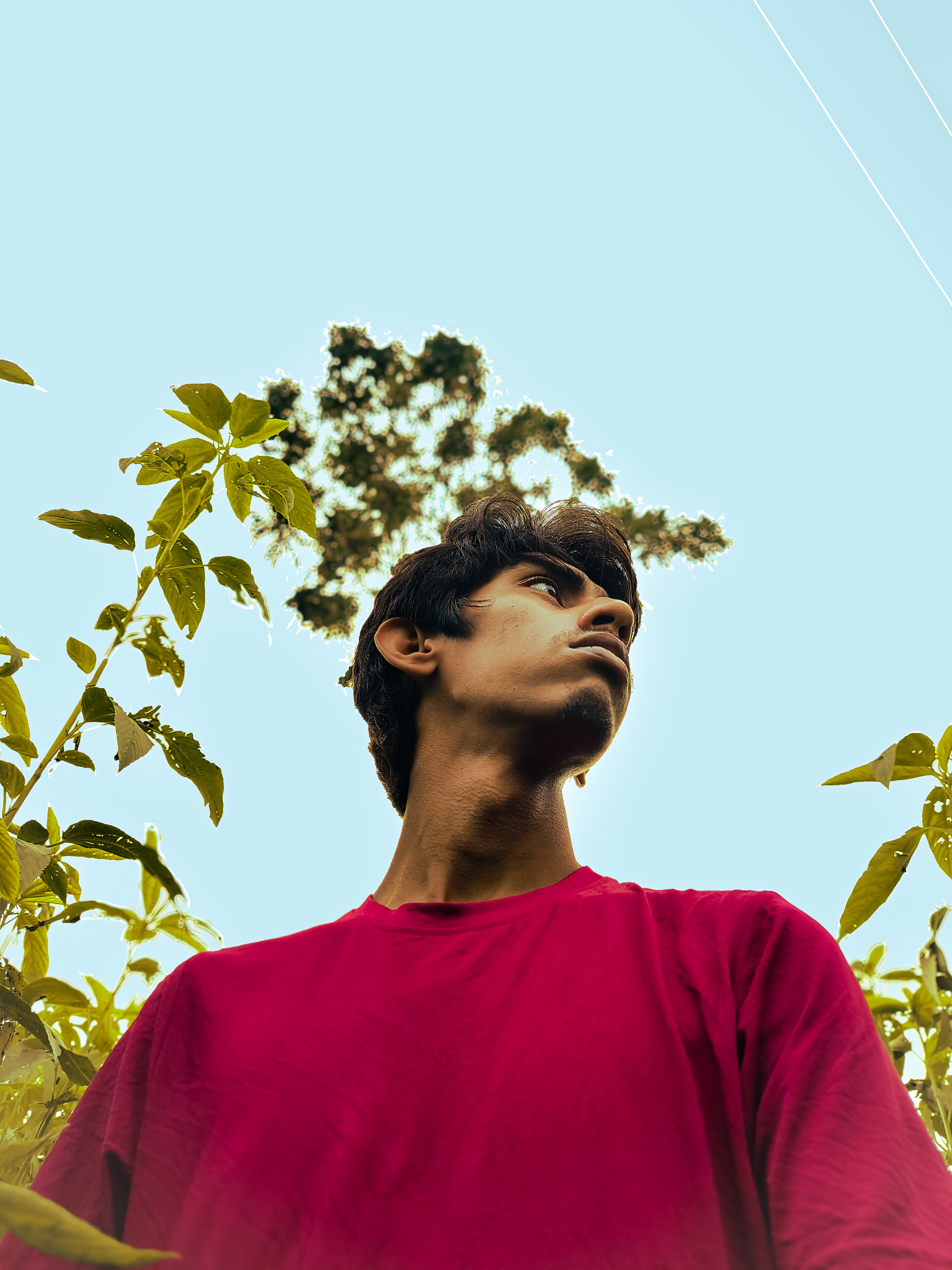 Ahnaf Abror, low-angle portrait outdoors